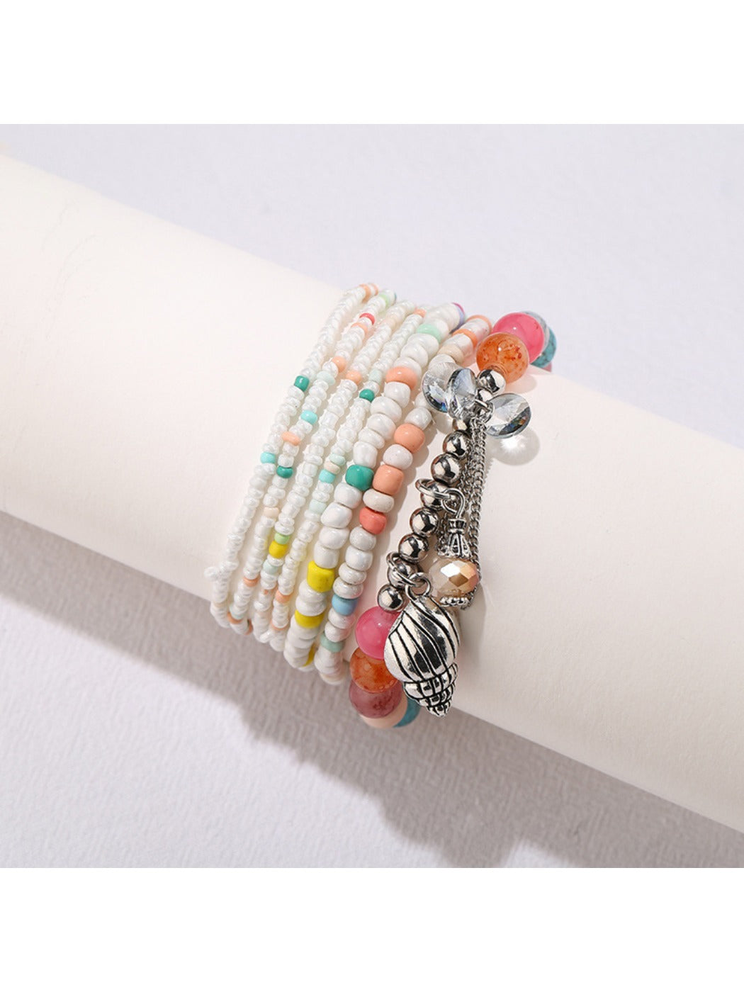 Lovra alloy pendant beaded bracelet coiled to display full design and bead pattern