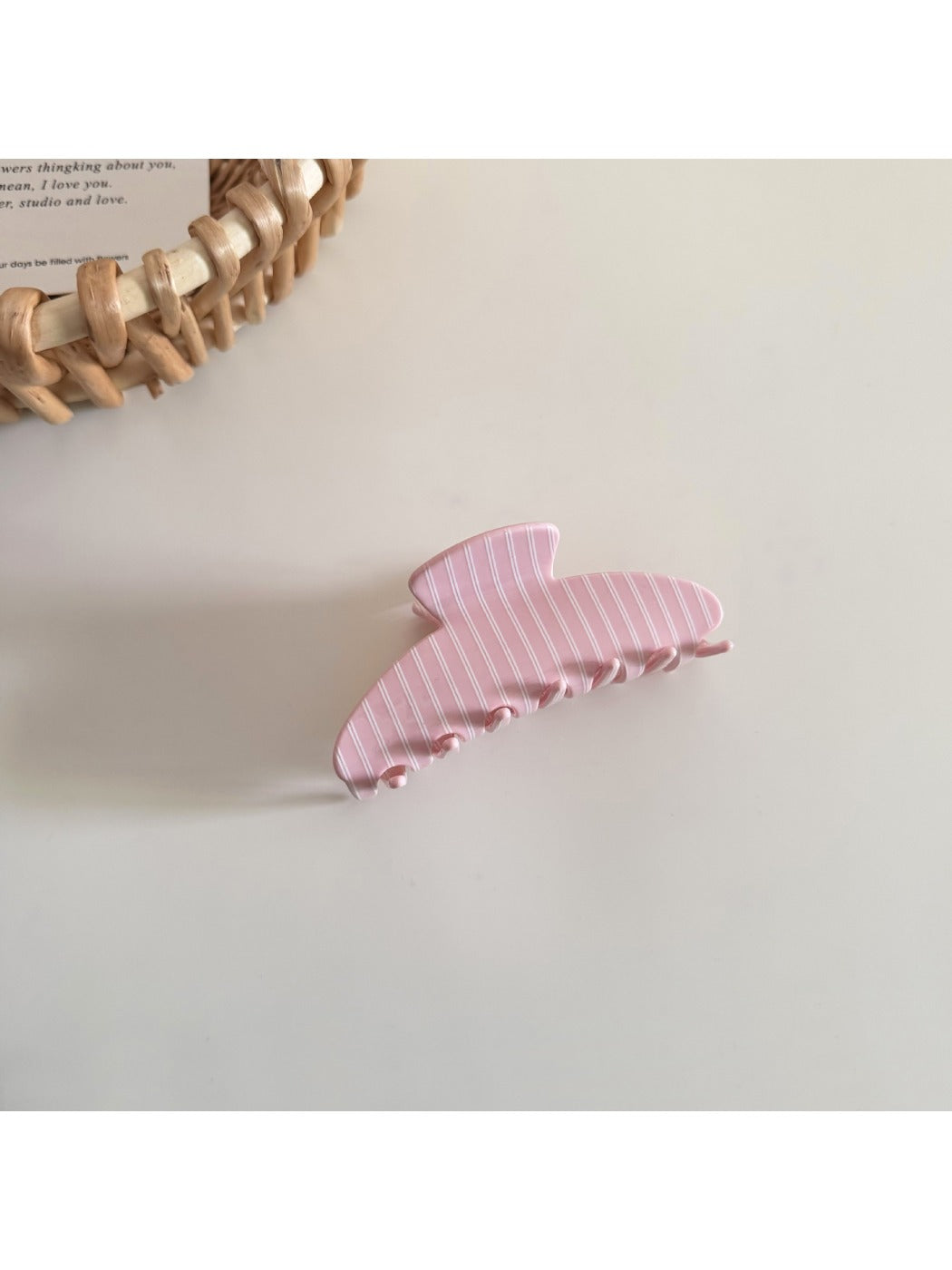 Beau hair clip angled to show thickness and glossy finish of acetate material