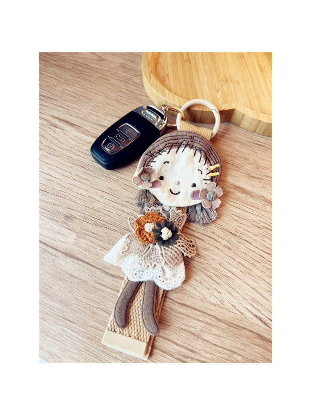 Keypus keychain displayed in a gift box with soft fabric lining