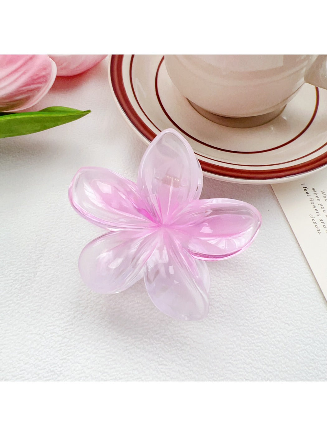Beau classic colorful flower shaped claw clip isolated on plain white background