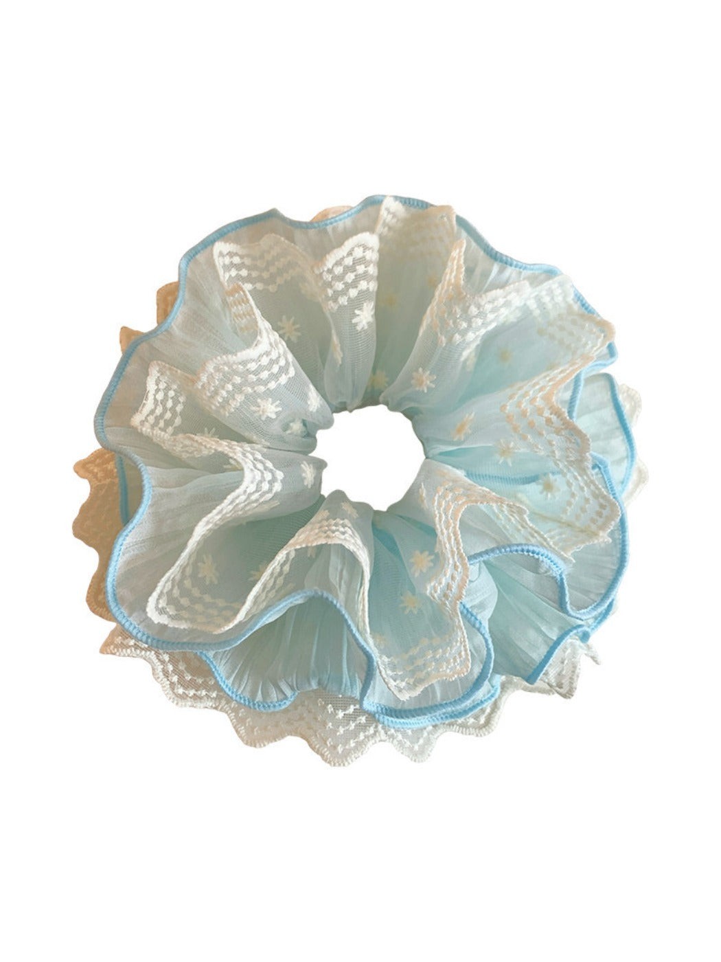 Blue lace scrunchie styled on a wrist as a bracelet accessory