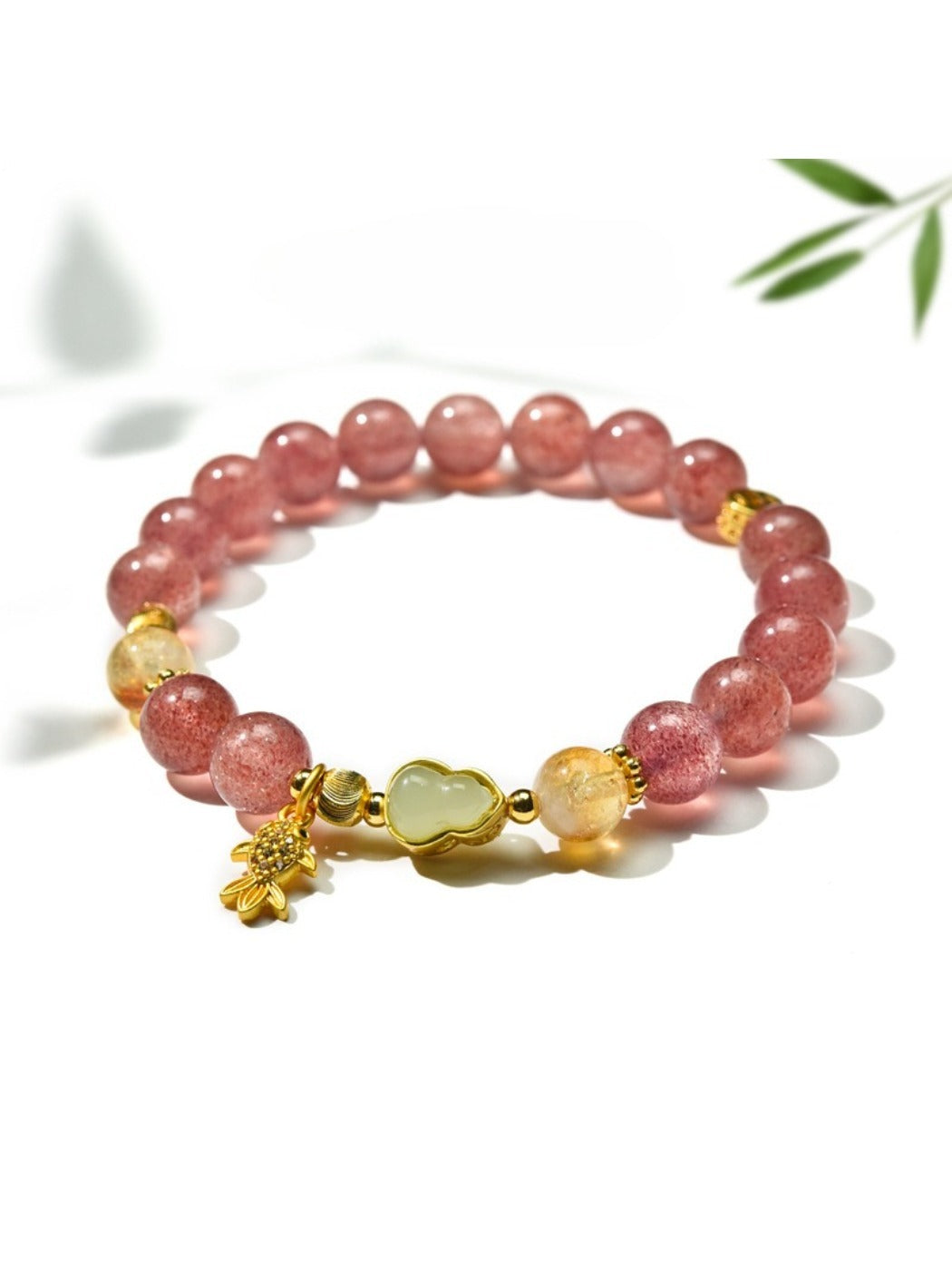 Lovra bracelet featuring goldfish pendant and clear crystal beads on wrist