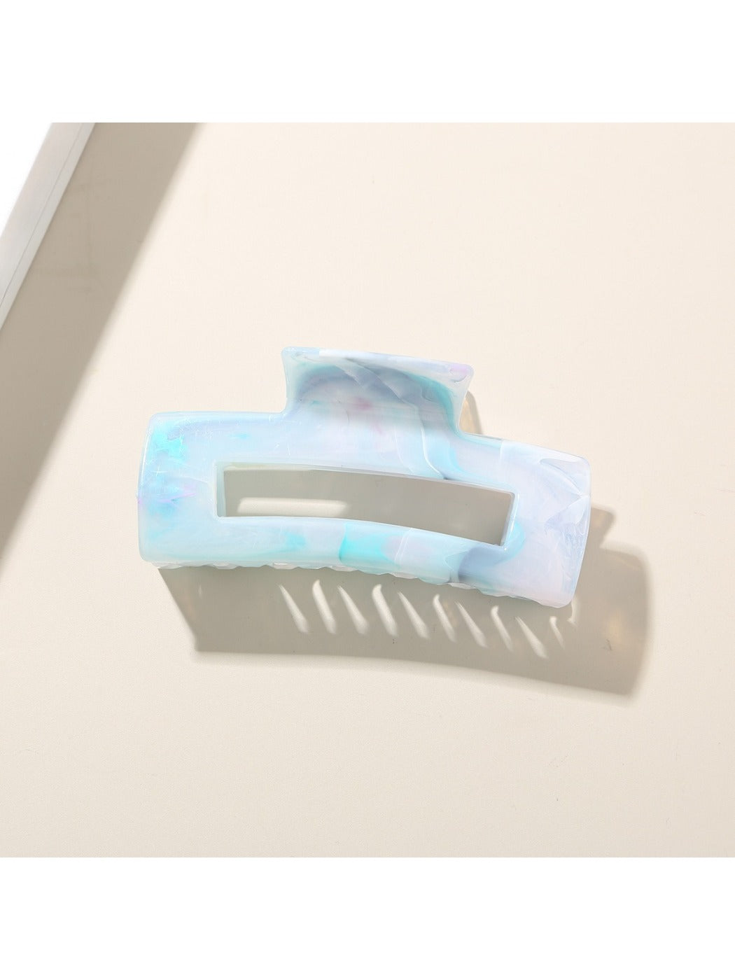 Beau hair clip next to matching accessories on a white background for styling inspiration
