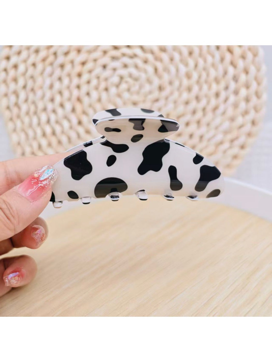 Beau leopard print claw clip next to matching hair accessories