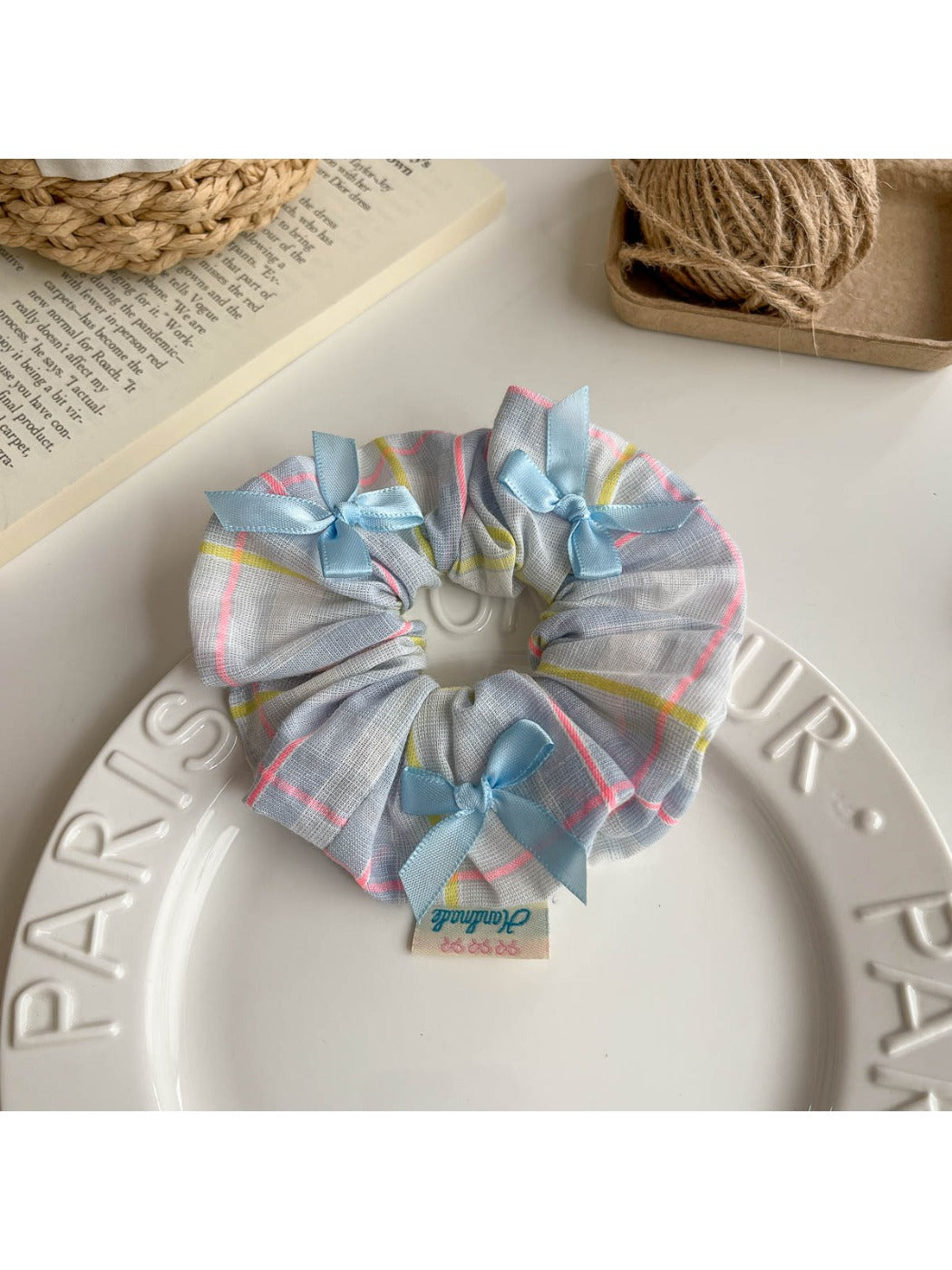 Multiple Gifty Ribbon Bow Plaid Scrunchies in different plaid patterns arranged together