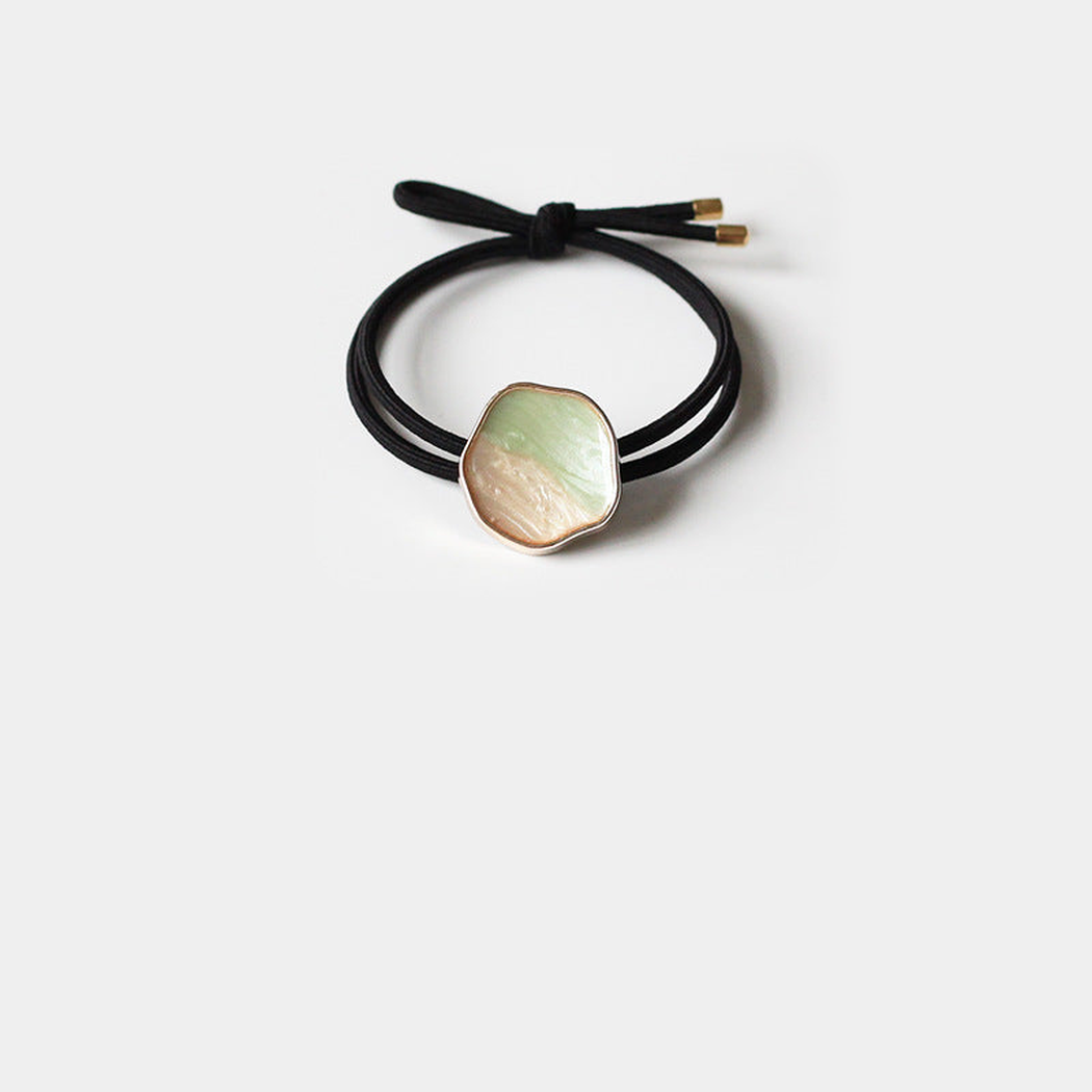 Black Gifty - Glazed Bead Hair Tie on neutral background