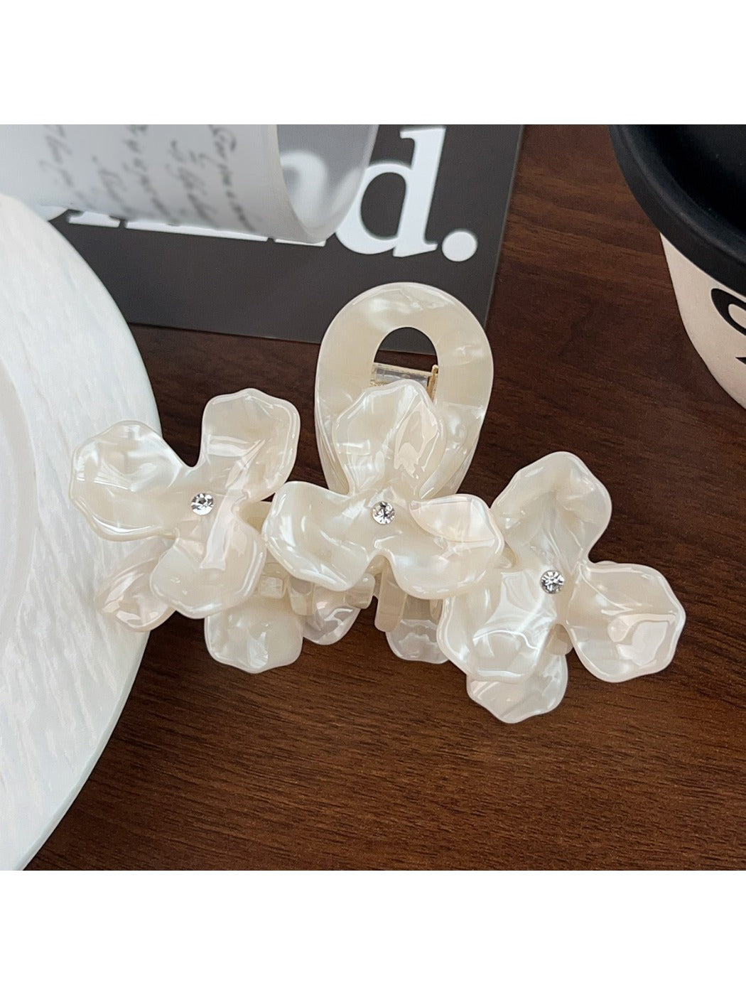 Beau floral hair claw clip shown open to display inner clasp mechanism and design