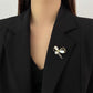 Gold bow brooch, detail view