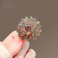 Multicolor dandelion brooch, detail view