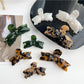 Close-up of Beau bow shaped hair claw clip showing smooth matte finish
