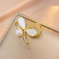 Gold bow brooch, detail view