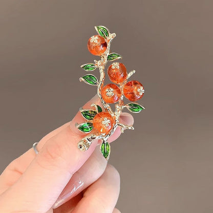 Orange fruit cluster brooch, variant view