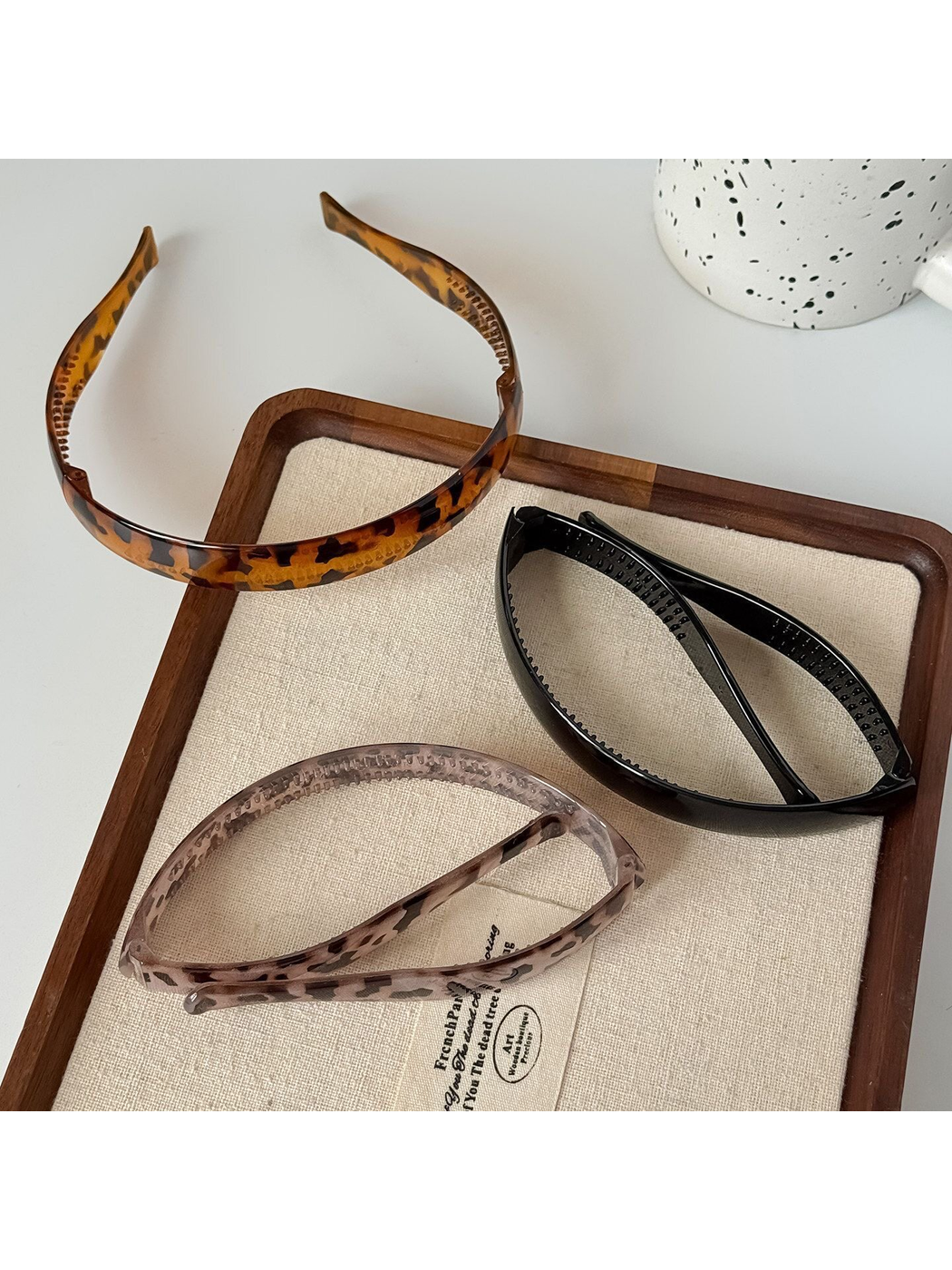 Leopard print foldable plastic headband displayed on white background