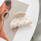 Top view of Beau chic crescent hair claw clip showing smooth curved edges