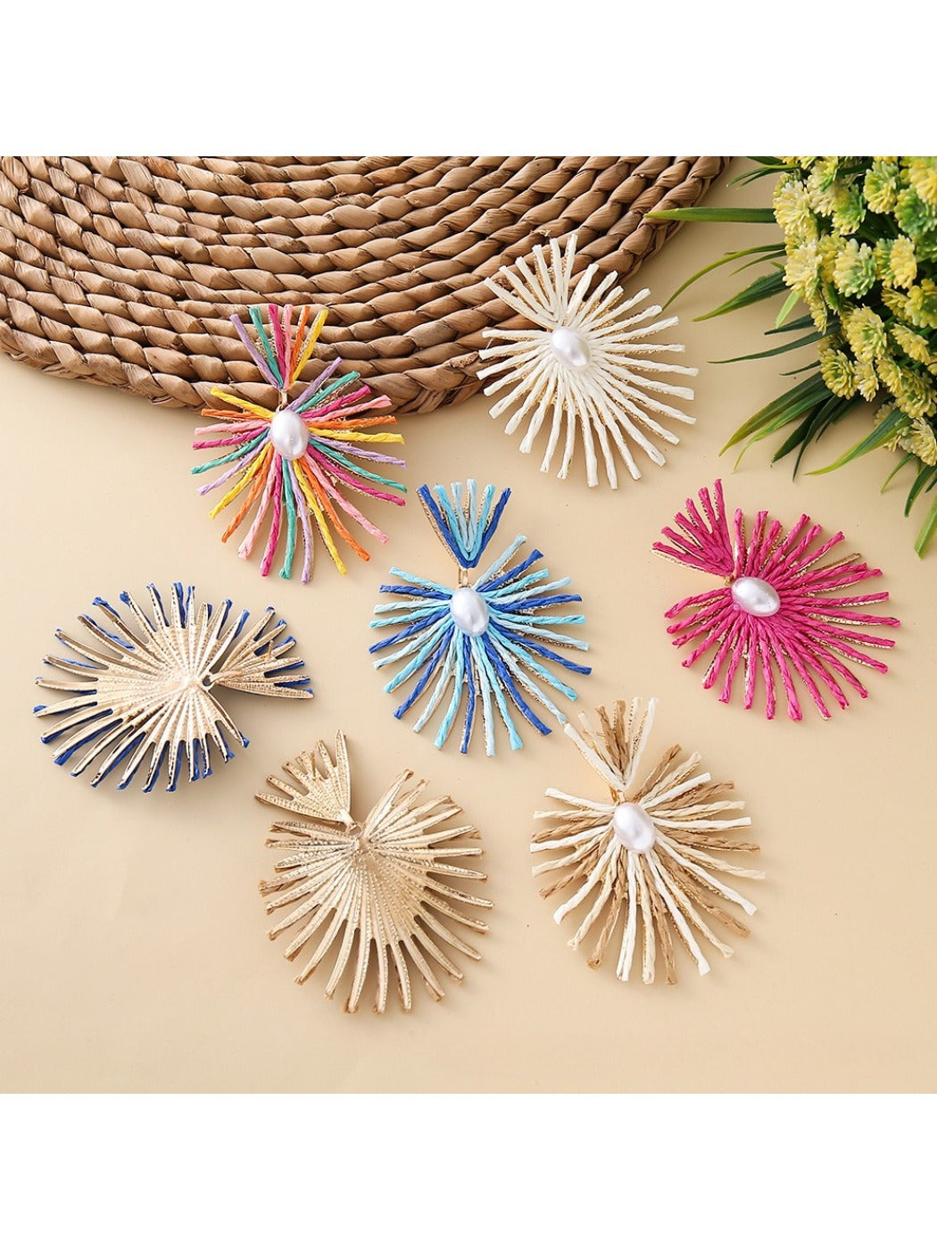 Earedge raffia drop earrings hanging from a jewelry stand