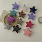 Side view of Beau star shaped claw clip highlighting spring mechanism