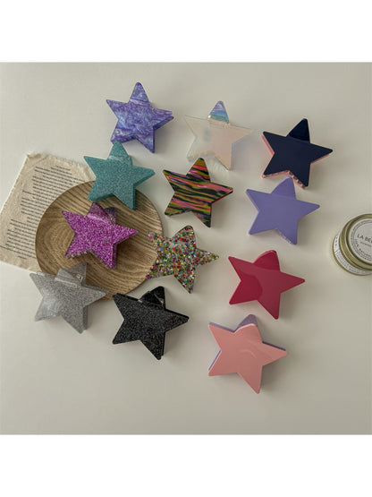 Side view of Beau star shaped claw clip highlighting spring mechanism
