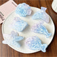 Close-up of Beau blue ocean style claw clip highlighting wave pattern