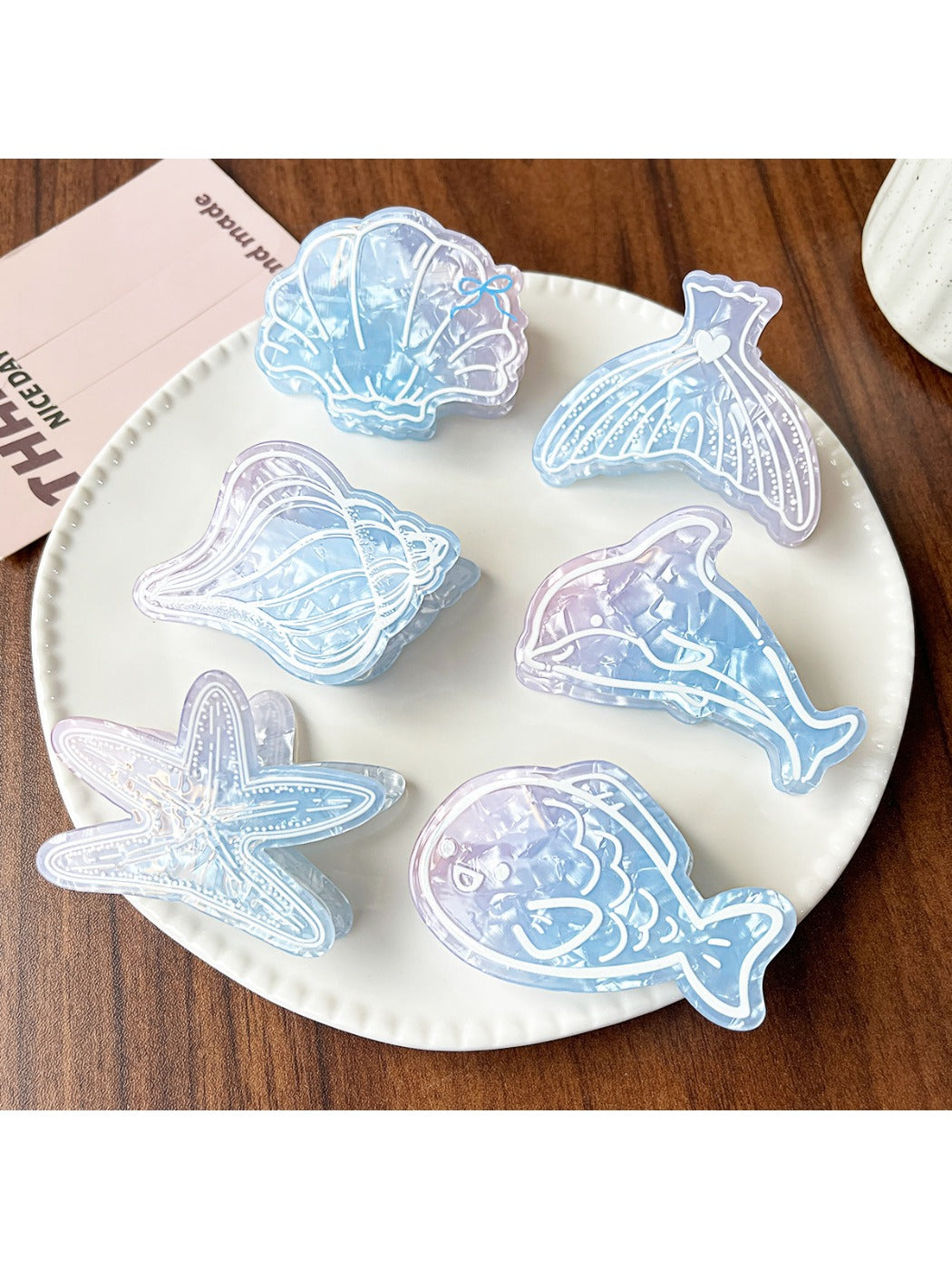 Close-up of Beau blue ocean style claw clip highlighting wave pattern