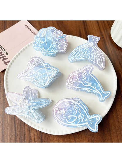 Close-up of Beau blue ocean style claw clip highlighting wave pattern