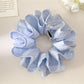 Blue polka dot double layer scrunchie on white background