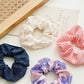 White Floral Scrunchie showing multiple available variants