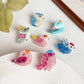 Mini bird character hair claw clips, variant overview