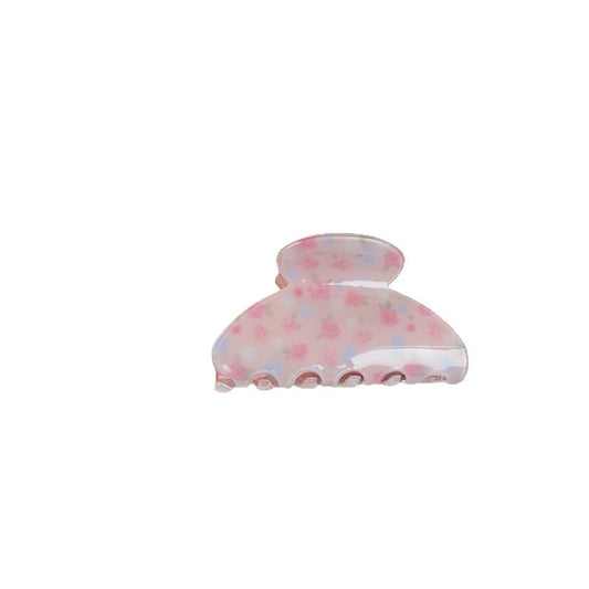 Pink floral hair claw clip on white background