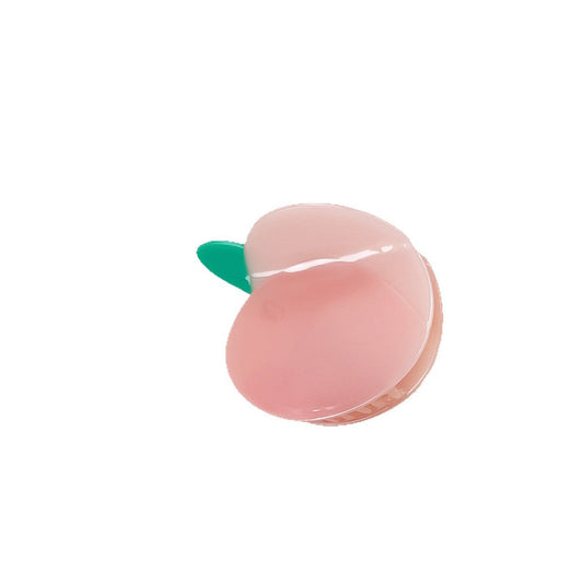 Pink peach hair claw clip on white background