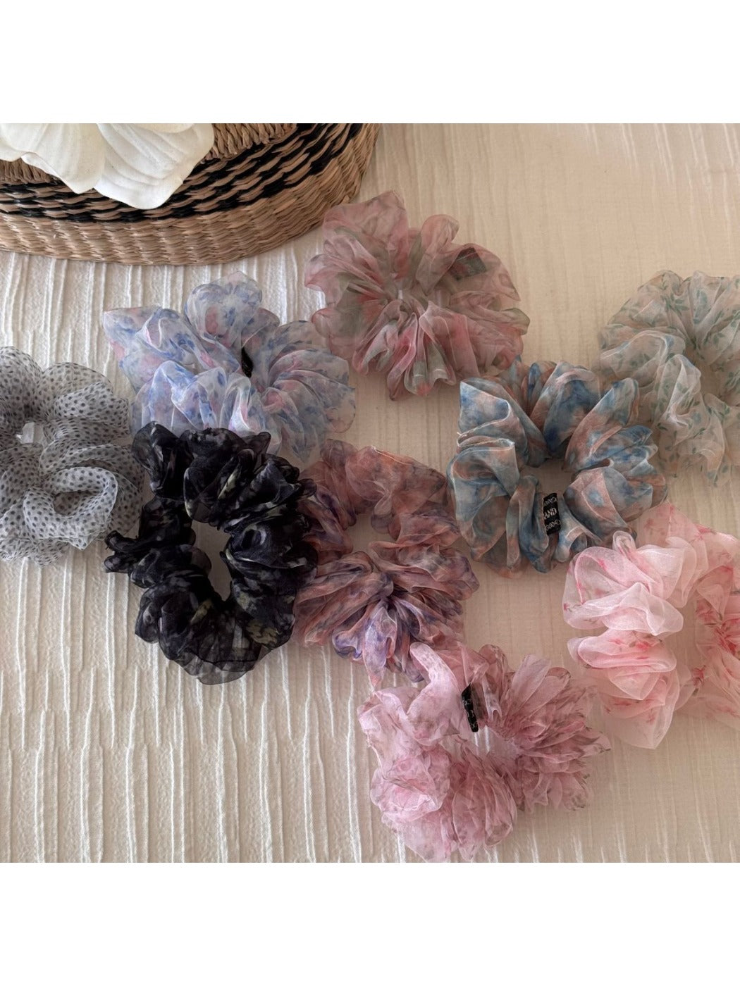 Side view of floral scrunchie showing gathered fabric texture