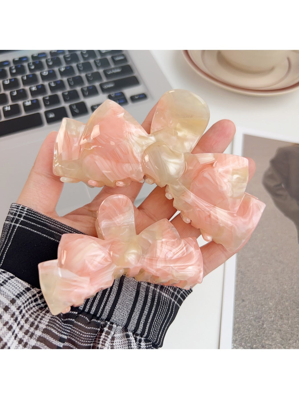 Beau hair claw clip holding a section of blonde hair