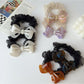 Close-up of Gifty mesh bow acetate scrunchie in soft pastel color