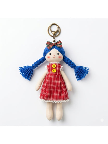 Fabric yarn doll keychain with multicolored yarn hair and traditional outfit details