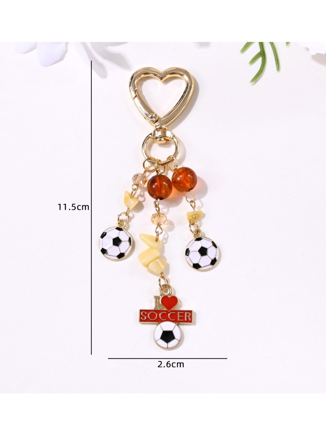 Side view of the sports ball keychain showing its round shape and texture