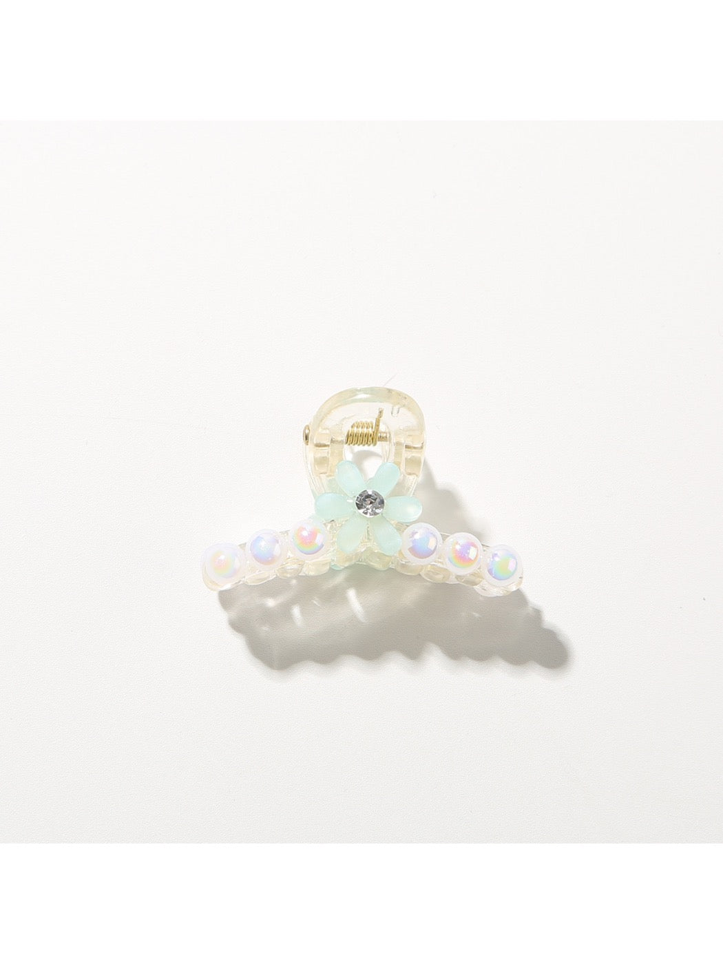 Bright multi color hair clip with clasp partially open
