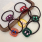 Gifty - Block Smiley Face Hair Tie