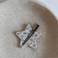 Beau printed triangle star hair clip angled to show thickness and design