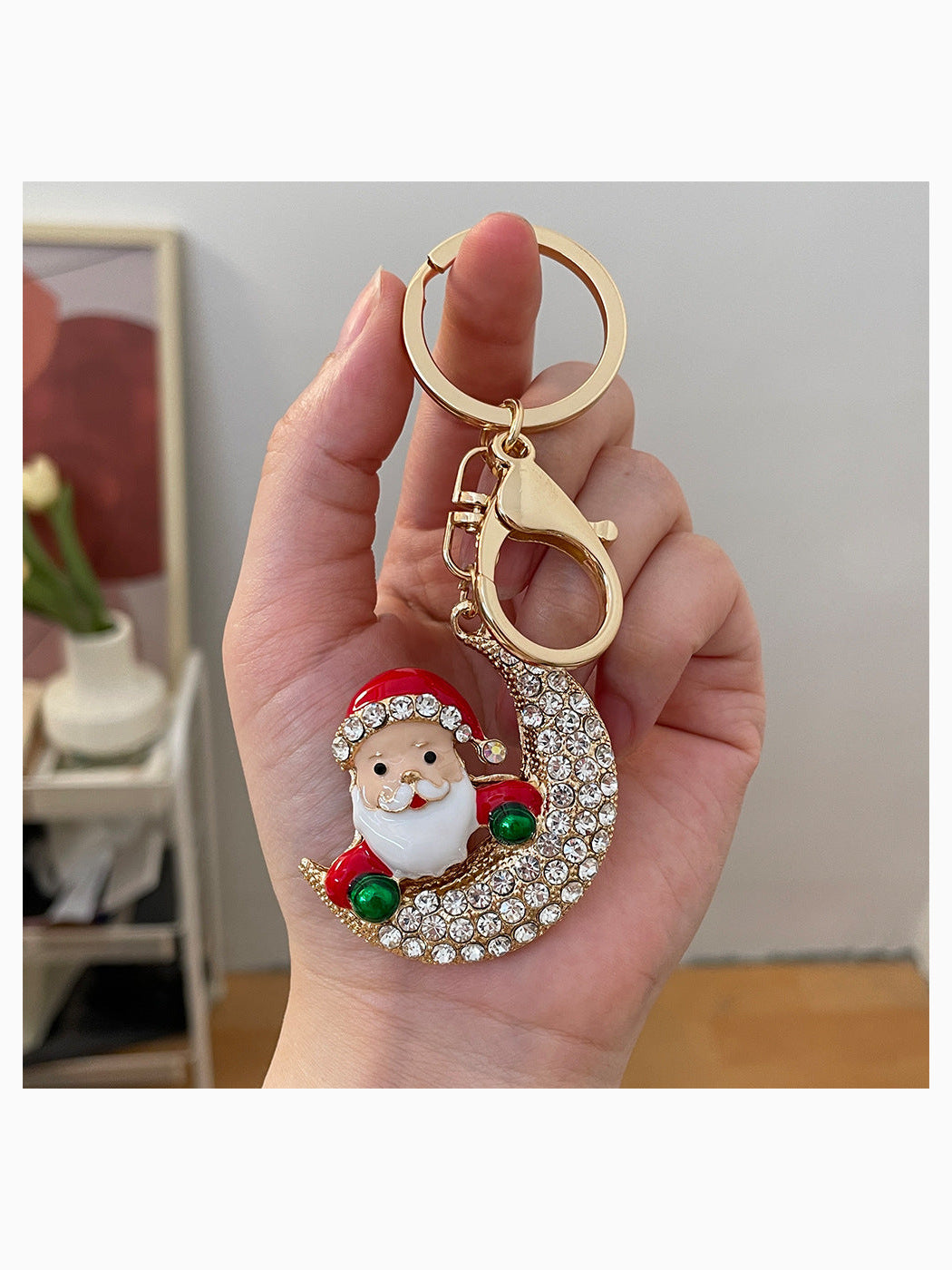 Christmas Santa crescent moon keychain held in hand