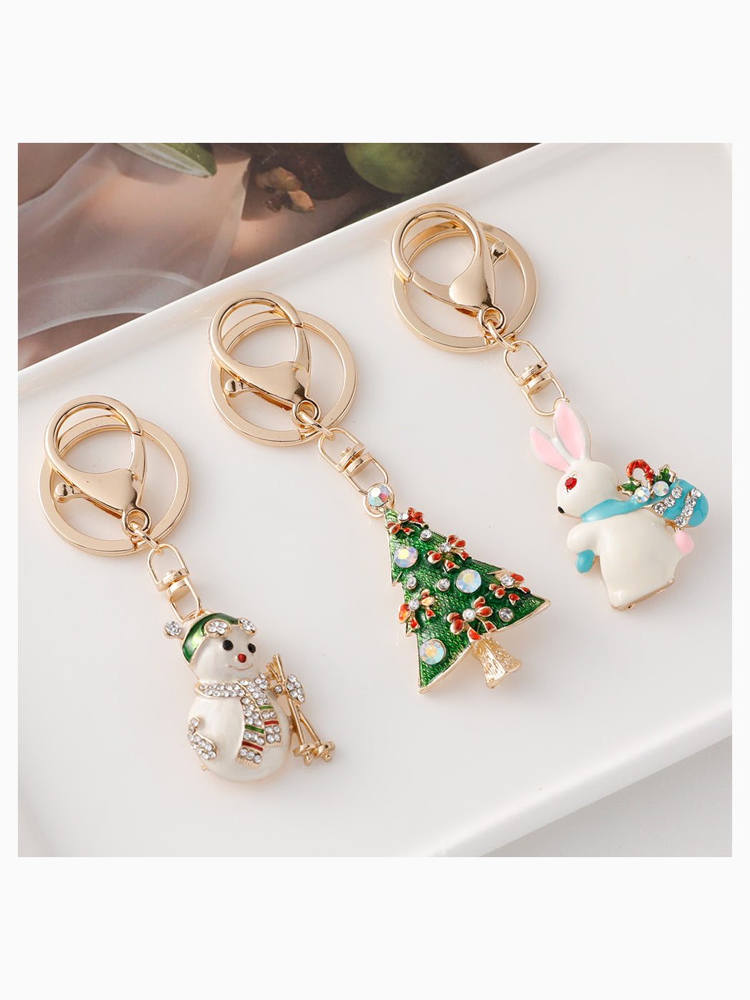 Christmas tree, snowman, stocking and rabbit keychains
