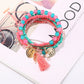 Lovra metal tassel pendant bracelet styled with casual outfit
