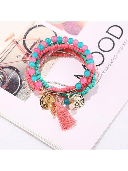 Lovra metal tassel pendant bracelet styled with casual outfit