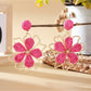 Earedge flower shaped drop earrings styled with a matching necklace