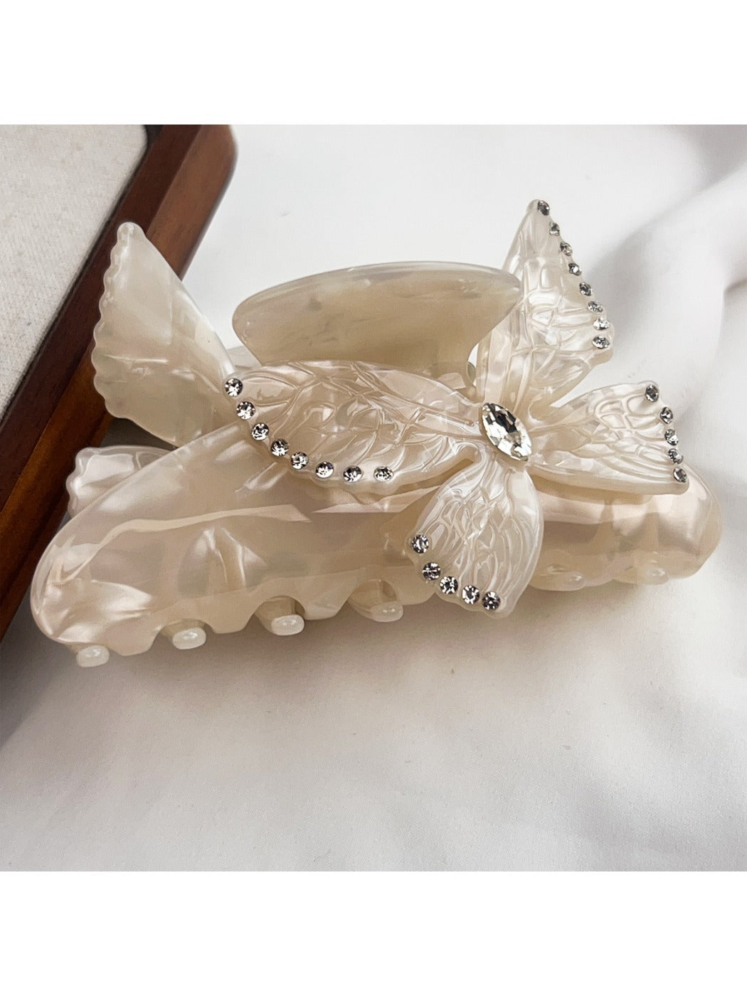 Detailed shot of butterfly motifs on Beau colorful hair claw clip
