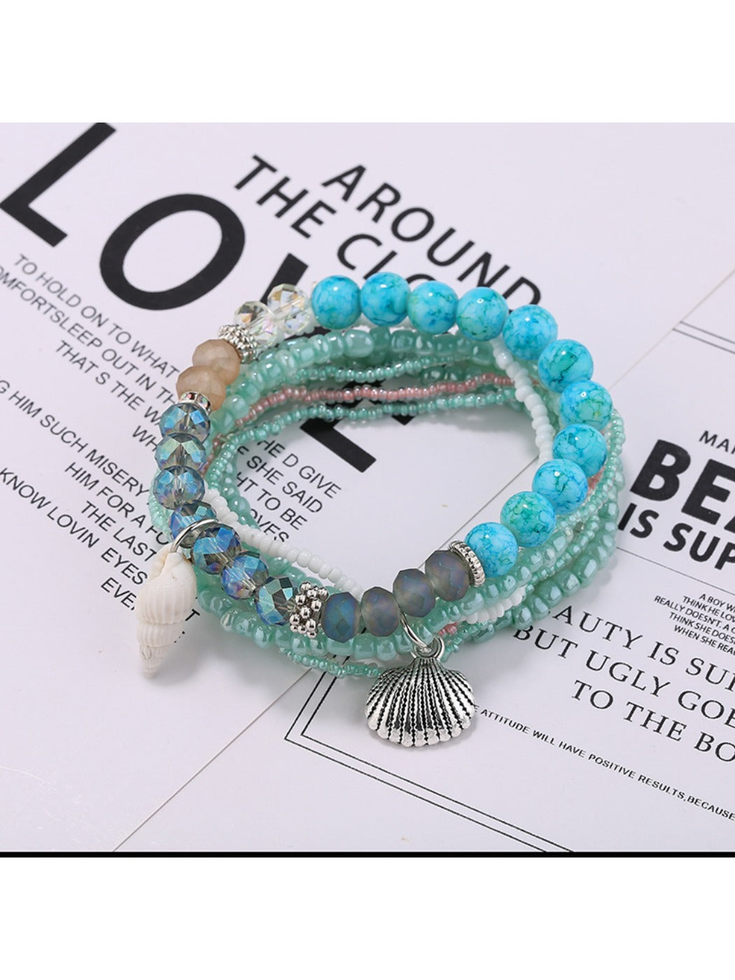 Multiple Lovra stackable beaded bracelets arranged in a circle