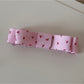 Top view of Beau pink floral pattern hair clip with metal clip visible