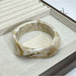 Top view of Lovra irregular shaped ombre bangle showing color transition