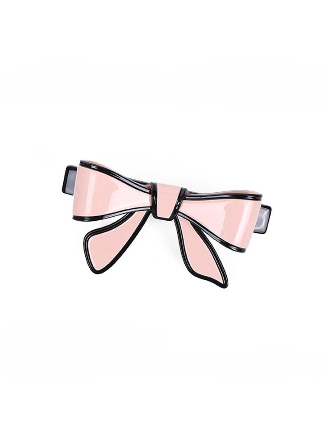 Beau bow hair clip displayed on a wooden surface with natural lighting