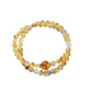 Side view of Lovra yellow crystal multi-wrap bracelet showing bead details