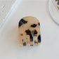 Beau acetate hair clip open to display metal clasp and hinge details