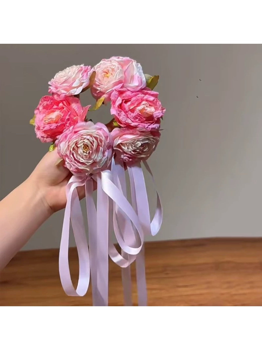 Beau Sweet Lifelike Flower Ribbon Hair Clip attached to brown hair